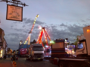 Dusk falls as Thame fair is being set up in the Upper High Street