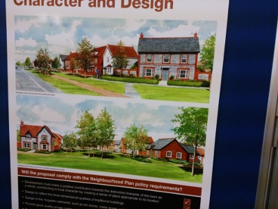 Exhibiition board showing artist's impression of some of the homes proposed for Site C
