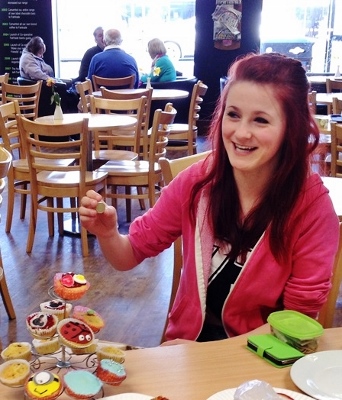 Chloe Morris in full cake-selling mode, raising funds for her friend, Nat Armstrong