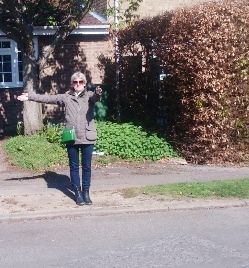 Cllr Helena Fickling, demonstrates where one of the new sign posts planned for Lea Park might be