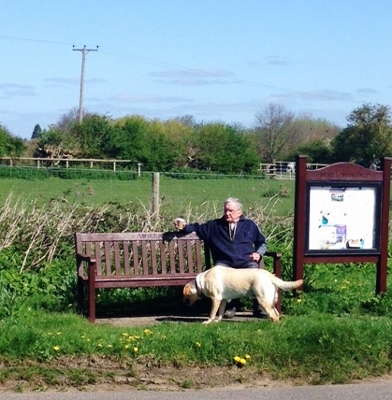 Moreton villager, Angus, and his dog, Ollie, take a rest during yesterday's Morton Muck Out day