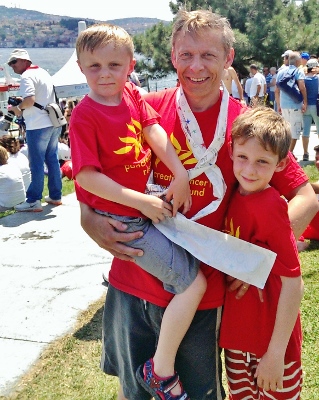 Mike Bishop after the swim, with his sons Isaac (L) and Henry (R) 