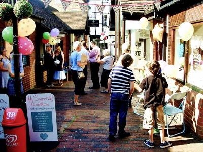 The party scene in Swan Walk, Thame, during the opening of My Sweet Art Creations, on July 26, 2014