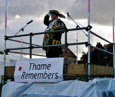 Thame's Town Crier, Anthony Church, doffs his hat to fallen of Thame