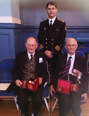 Jack Kirtland (left) a Russian naval officer called Dmitrii (centre) and Jim Barrett
