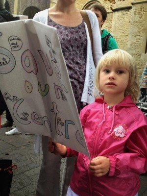 Child with banner at one of he many protests against closure of childrens centres -Image courtesy of Oxfordshire NASWT