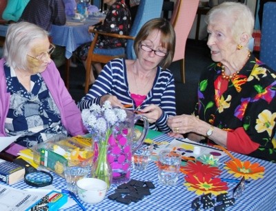 Sewing flowers at Thame & District Day Centre