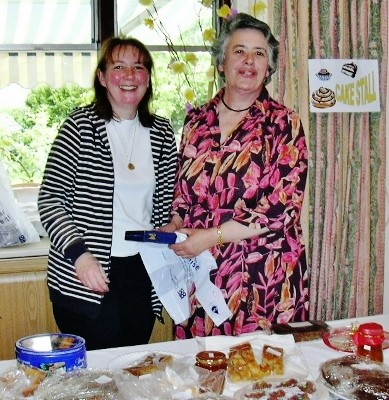 The late Beatrice Dobie (right), helping out with cake stall at a hospital fund raising event. (Also pictured, volunteer Val Saunders)