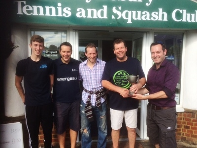 Ben Hedger, Oz Mustafa, Simon Martin receiving cup from Craig Bartlett. With another Aylesbury player in the middle.