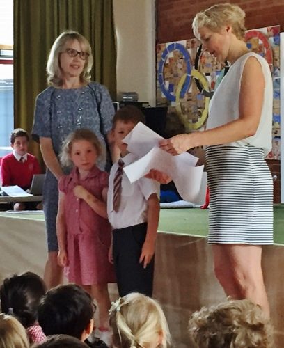 Sue Martin Downhill (right) with Headteacher Mrs Stopforth with pupil representatives